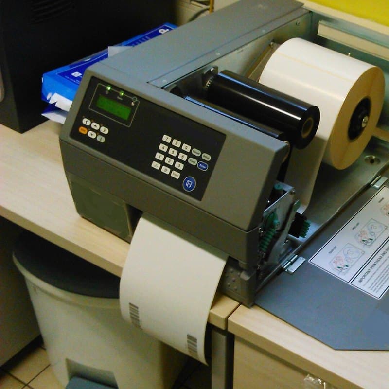 Thermal label printer with label roll and ribbon